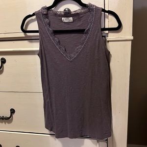 Purple sleeveless top with lace neckline